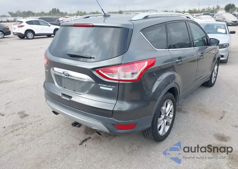 2016 Ford Escape Titanium z USA, uszkodzony, nr VIN 1FMCU0J99GUB82276
